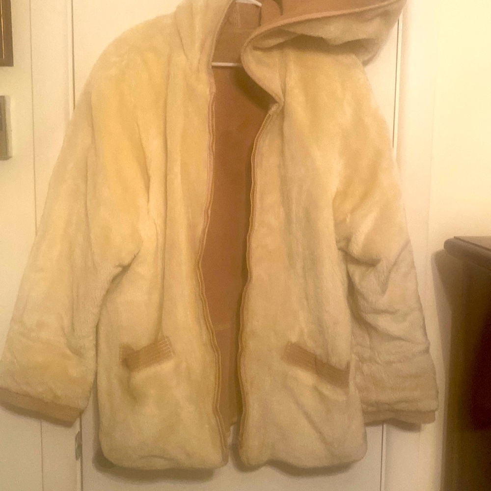 This is a leather and fur coat